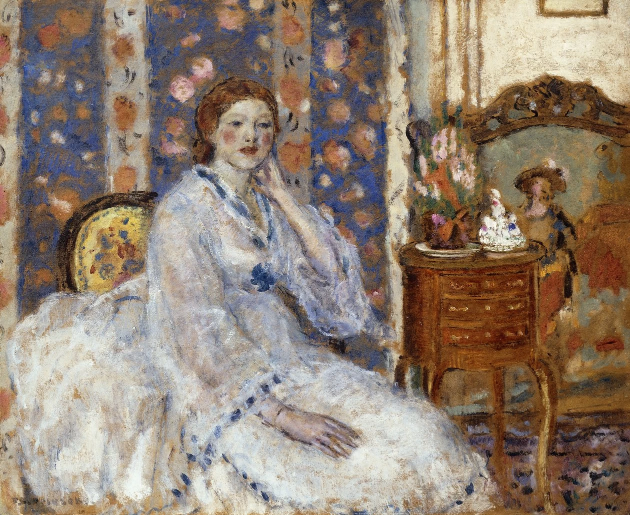 Donna seduta in poltrona